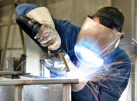man welding steel 